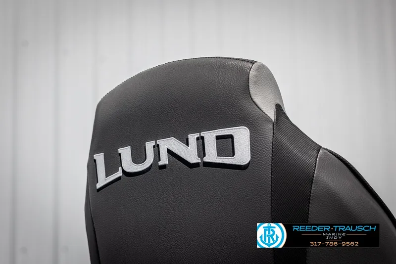 Slide: The Image of 2025 Lund 1600 Fury Heritage Edition boat seat with logo, featuring sleek black design. - 20