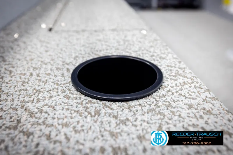 Slide: The Image of 2025 Lund 1600 Fury Heritage Edition boat detail with textured surface and cup holder. - 21