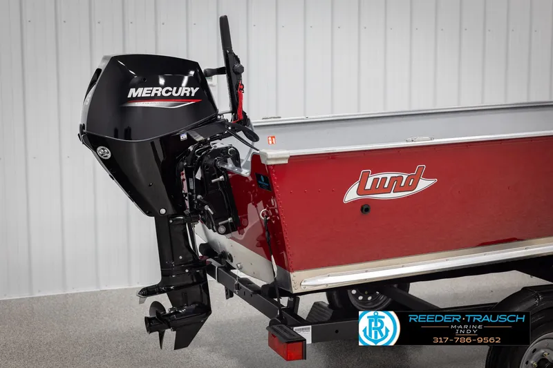 Slide: The Image of 2025 Lund 1600 Fury Heritage Edition boat with Mercury outboard motor, red hull. - 22