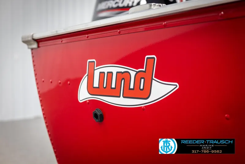 Slide: The Image of Red 2025 Lund 1600 Fury Heritage Edition boat with logo and Reeder-Trausch Marine contact. - 26