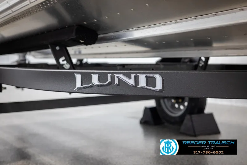 Slide: The Image of 2025 Lund 1600 Fury Heritage Edition boat trailer close-up with logo. - 27