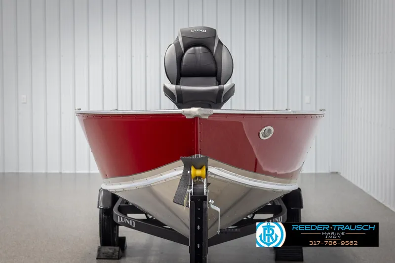 Slide: The Image of 2025 Lund 1600 Fury Heritage Edition boat in showroom, red hull, on trailer. - 6