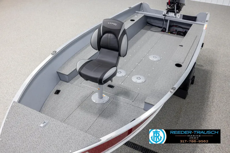 Slide: The Image of 2025 Lund 1600 Fury Heritage Edition boat interior with single seat and fishing deck. - 8