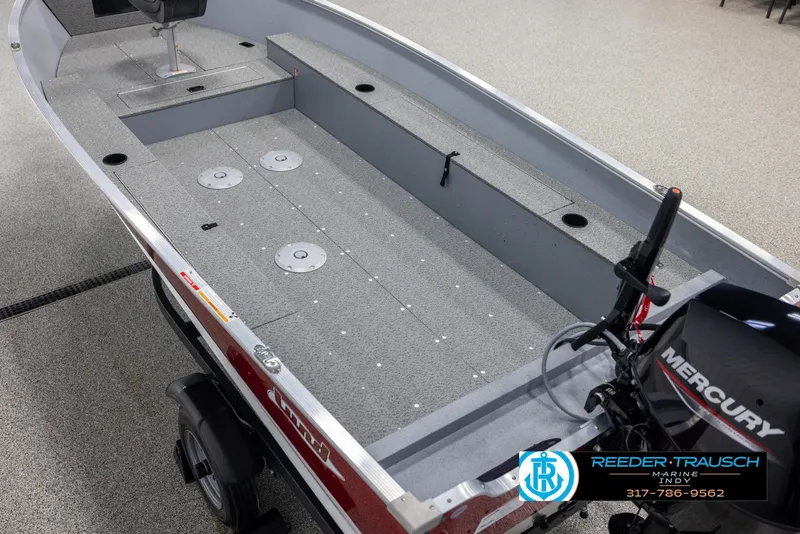 Slide: The Image of 2025 Lund 1600 Fury Heritage Edition boat interior with Mercury motor, showcased by Reeder-Trausch Marine. - 9