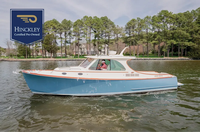 The Image of Hinckley Picnic Boat MKII 2018 cruising on a lake, certified pre-owned. - 0