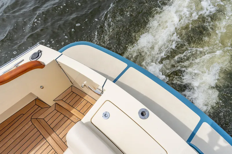 Slide: The Image of Hinckley Picnic Boat MKII 2018, teak deck, cruising on water, elegant design. - 21