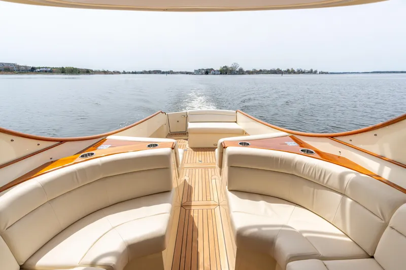 Slide: The Image of Hinckley Picnic Boat MKII 2018 interior with elegant seating and scenic water view. - 5