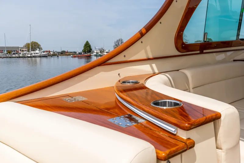 Slide: The Image of Luxurious interior of 2018 Hinckley Picnic Boat MKII with polished wood and leather seating. - 8