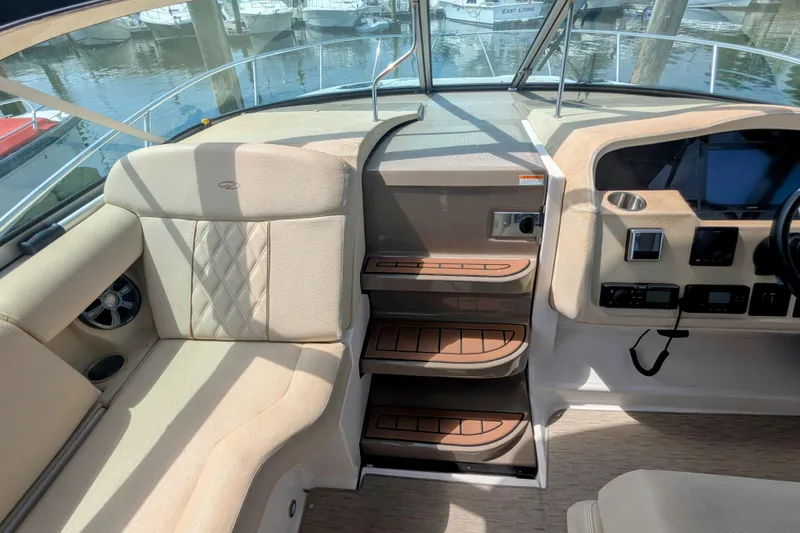 Slide: The Image of Interior of 2018 Regal 33 XO boat showing seating and control panel. - 19