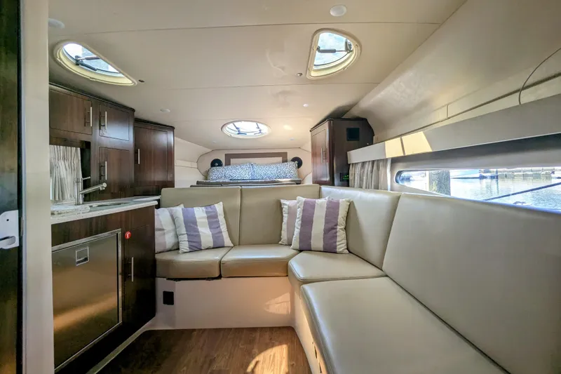 Slide: The Image of Luxurious interior of 2018 Regal 33 XO yacht with seating and kitchenette. - 21