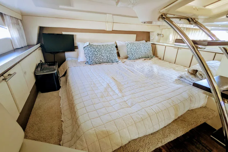 Slide: The Image of Luxurious interior cabin of 2018 Regal 33 XO yacht with cozy bedding and modern decor. - 22