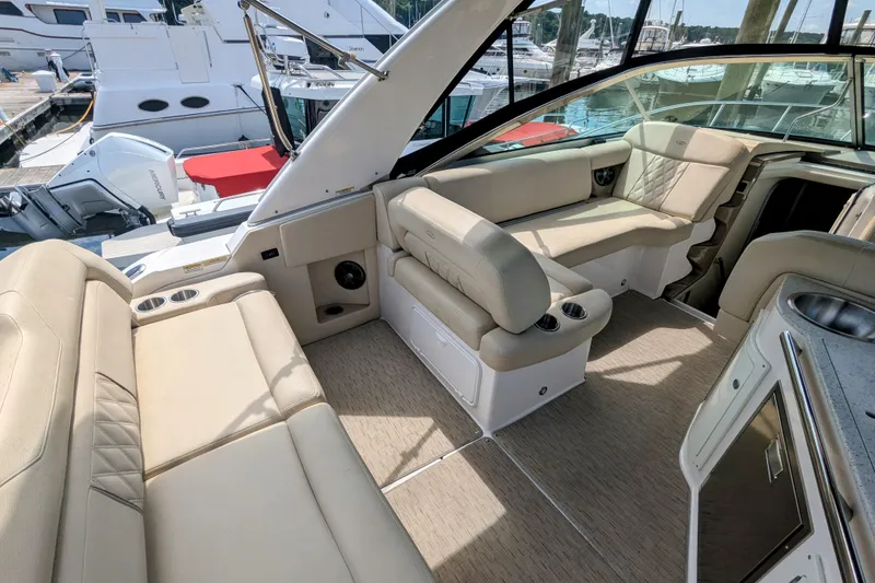 Slide: The Image of Luxurious interior of 2018 Regal 33 XO boat with beige seating and modern amenities. - 9