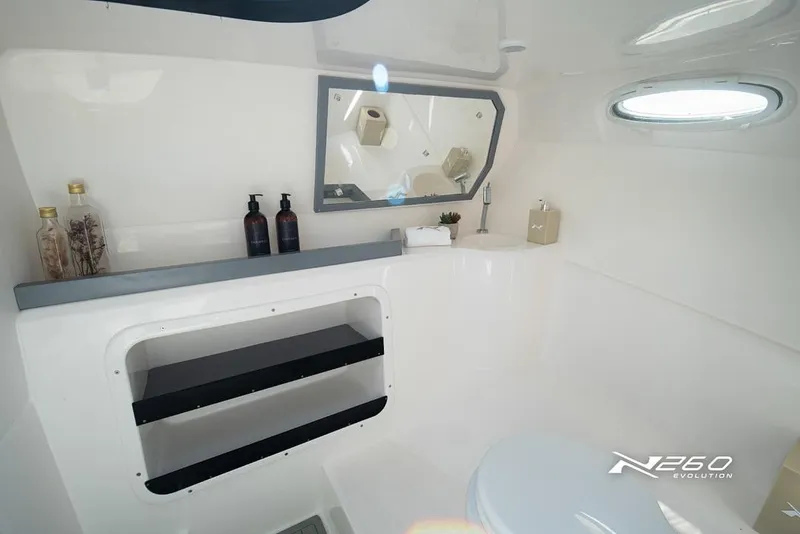 Slide: The Image of Modern bathroom interior of 2025 NX Boats NX260 EVOLUTION, featuring sleek design and amenities. - 5