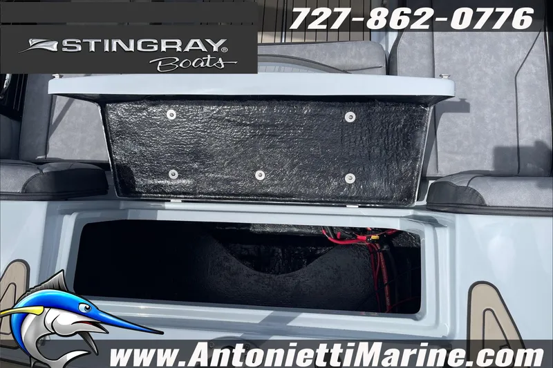 Slide: The Image of 2026 Stingray 23 OSX boat storage compartment, featuring Antonietti Marine branding and contact information. - 13