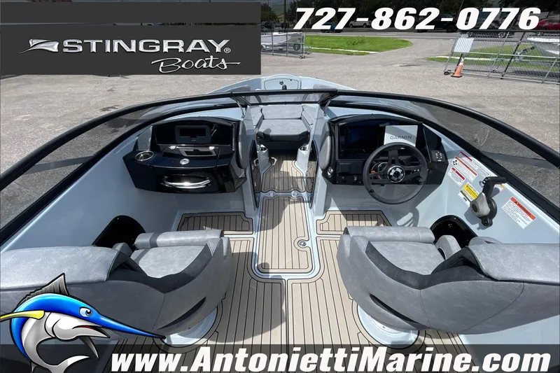 Slide: The Image of 2026 Stingray 23 OSX boat interior with modern dashboard and seating, Antonietti Marine branding. - 14