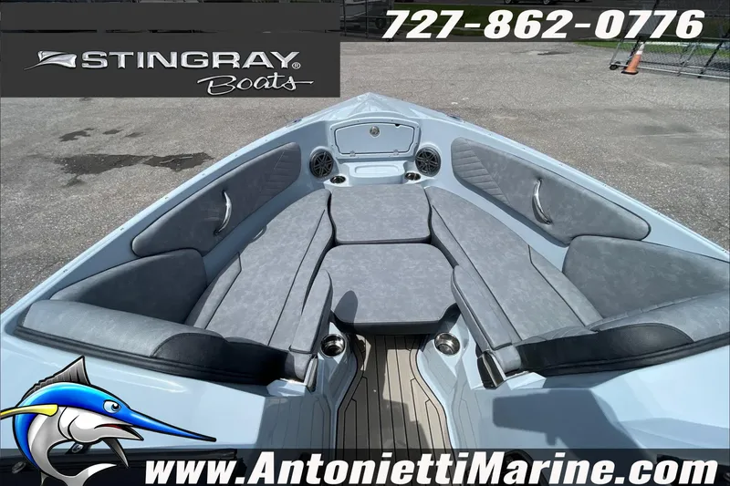 Slide: The Image of 2026 Stingray 23 OSX boat interior with gray seating, displayed by Antonietti Marine. - 15