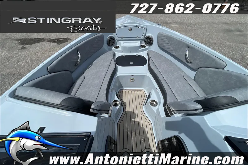 Slide: The Image of 2026 Stingray 23 OSX boat interior with seating, logo, and contact details for Antonietti Marine. - 16