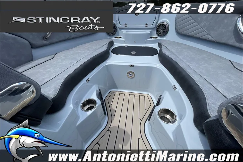 Slide: The Image of Interior view of 2026 Stingray 23 OSX boat with seating and cup holders. - 22