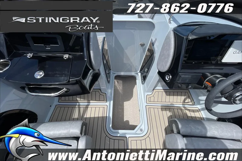 Slide: The Image of 2026 Stingray 23 OSX boat interior with modern dashboard and seating, Antonietti Marine branding. - 27