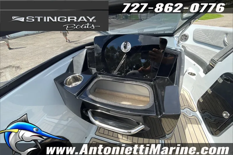 Slide: The Image of 2026 Stingray 23 OSX boat interior with sleek design and modern amenities. - 32