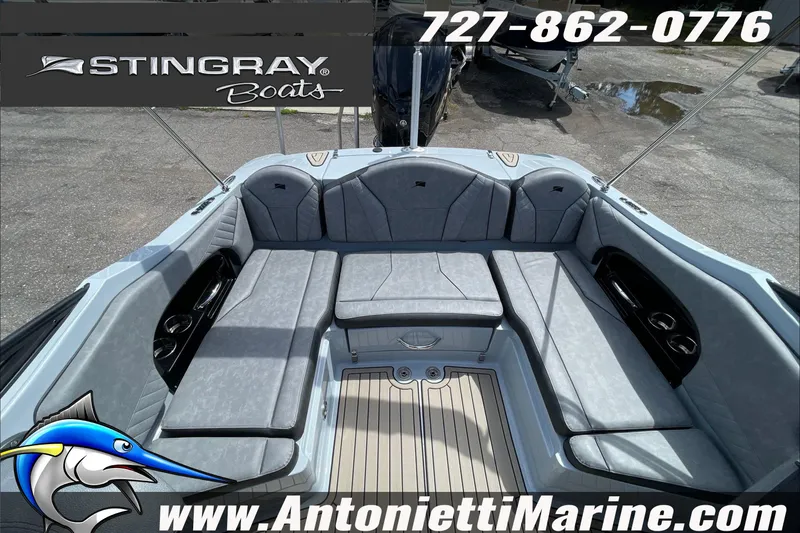 Slide: The Image of 2026 Stingray 23 OSX boat interior with gray seating, showcased by Antonietti Marine. - 33
