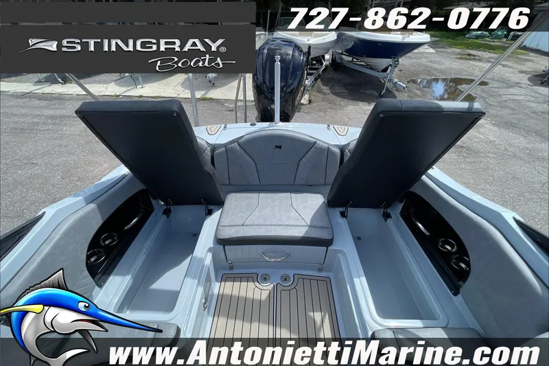 Slide: The Image of 2026 Stingray 23 OSX boat interior with seating, displayed at Antonietti Marine. - 34
