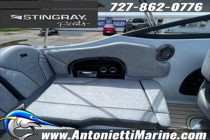 Slide: The Image of Interior of 2026 Stingray 23 OSX boat with gray seating and speaker. - 35