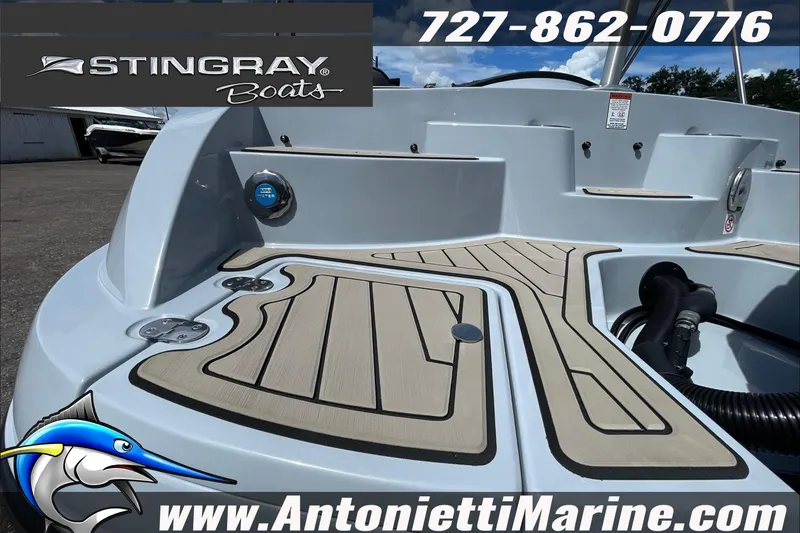 Slide: The Image of 2026 Stingray 23 OSX boat deck, featuring sleek design and marine accessories. - 39