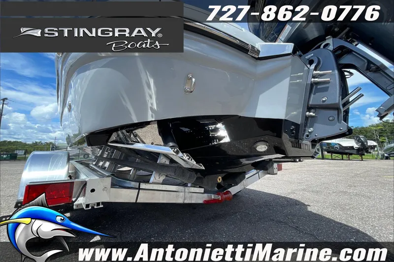 Slide: The Image of 2026 Stingray 23 OSX boat on trailer at Antonietti Marine dealership. - 42