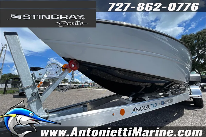 Slide: The Image of Stingray 23 OSX 2026 boat on trailer at Antonietti Marine dealership. - 43