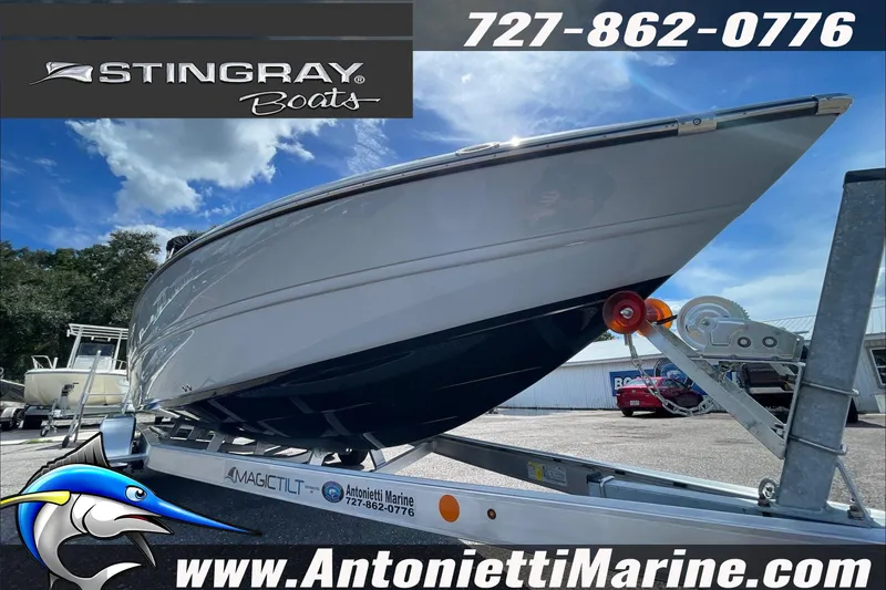 Slide: The Image of 2026 Stingray 23 OSX boat on trailer at Antonietti Marine dealership. - 44
