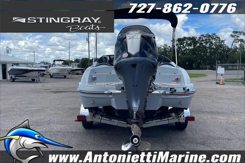 Slide: The Image of 2026 Stingray 23 OSX boat with powerful outboard motor at Antonietti Marine dealership. - 7