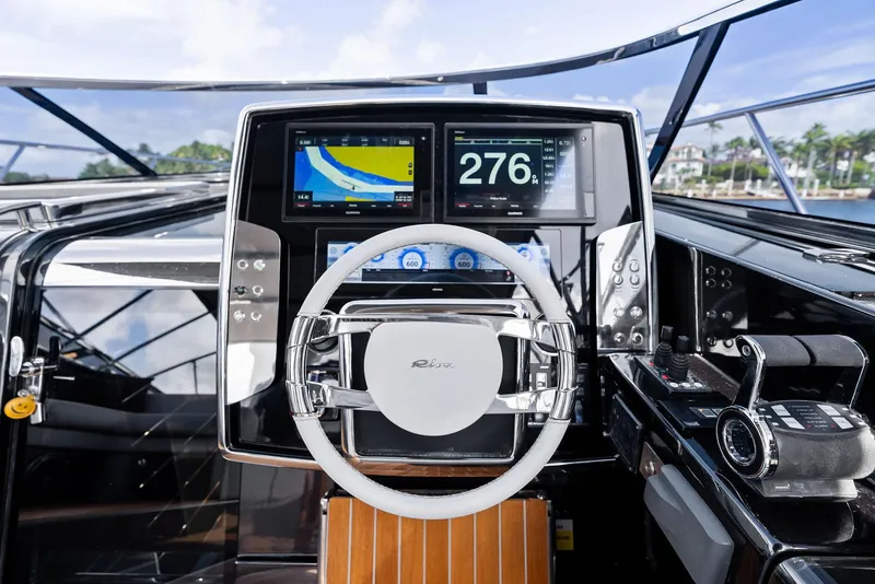 Slide: The Image of Cockpit of 2019 Riva 56 Rivale yacht with modern navigation displays and controls. - 20