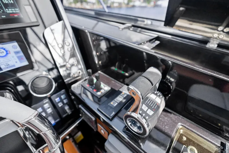 Slide: The Image of Control panel of 2019 Riva 56 Rivale yacht with modern navigation equipment. - 21