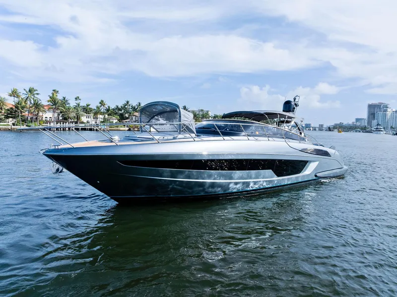 Slide: The Image of Luxury 2019 Riva 56 Rivale yacht with sleek design and wooden deck. - 9