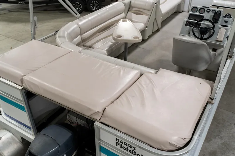 Slide: The Image of 1992 Harris FloteBote 240 Super Sunliner pontoon boat interior with seating and steering console. - 13