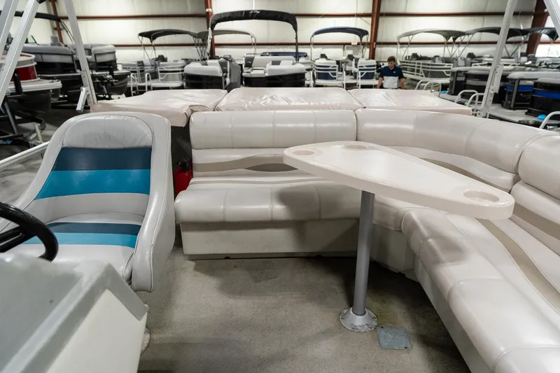 Slide: The Image of Interior of a 1992 Harris FloteBote 240 Super Sunliner pontoon boat with seating and table. - 16