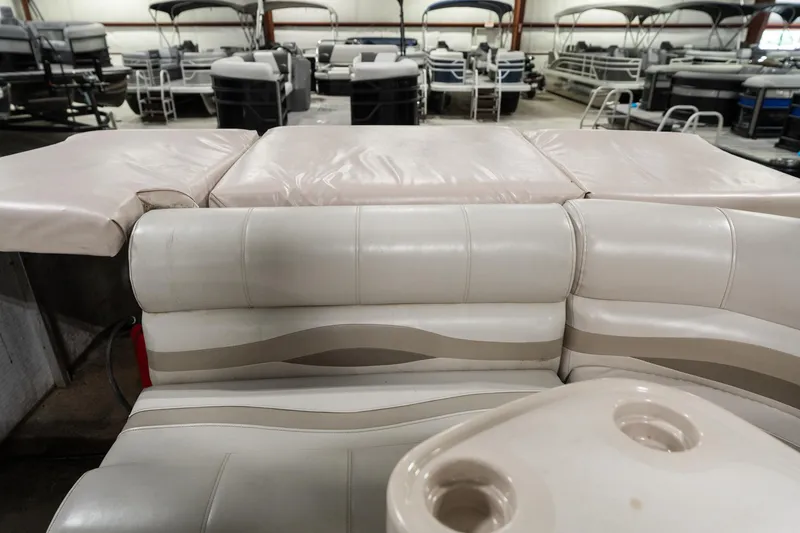 Slide: The Image of 1992 Harris FloteBote 240 Super Sunliner interior with beige seating in a showroom. - 18