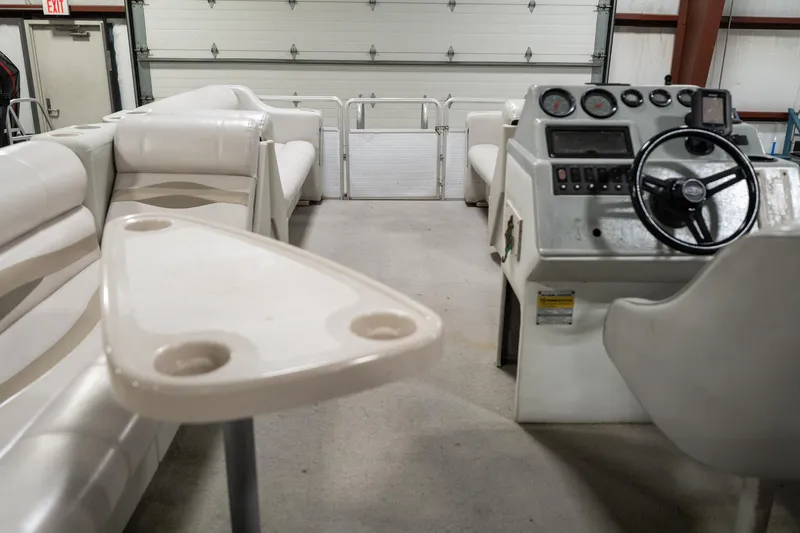 Slide: The Image of 1992 Harris FloteBote 240 Super Sunliner interior with steering console and seating. - 19