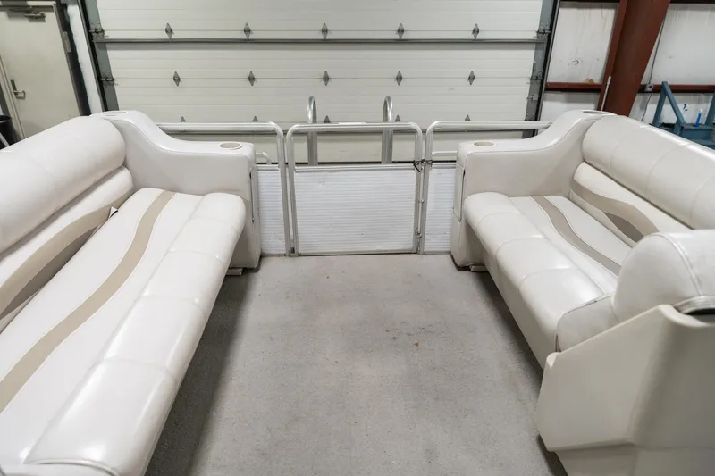 Slide: The Image of Interior of 1992 Harris FloteBote 240 Super Sunliner with white seating and cup holders. - 21