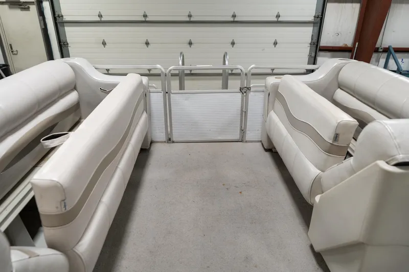 Slide: The Image of Interior of 1992 Harris FloteBote 240 Super Sunliner with white seating and storage compartments. - 22