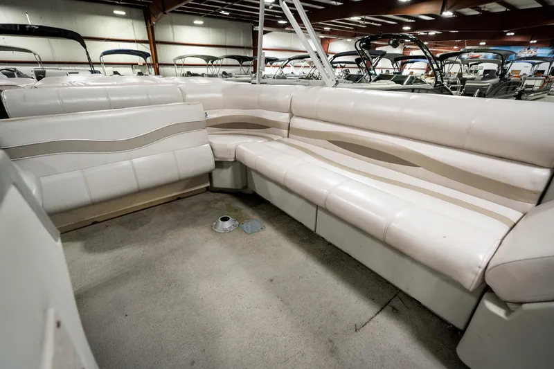 Slide: The Image of Interior of 1992 Harris FloteBote 240 Super Sunliner with white seating in showroom. - 27