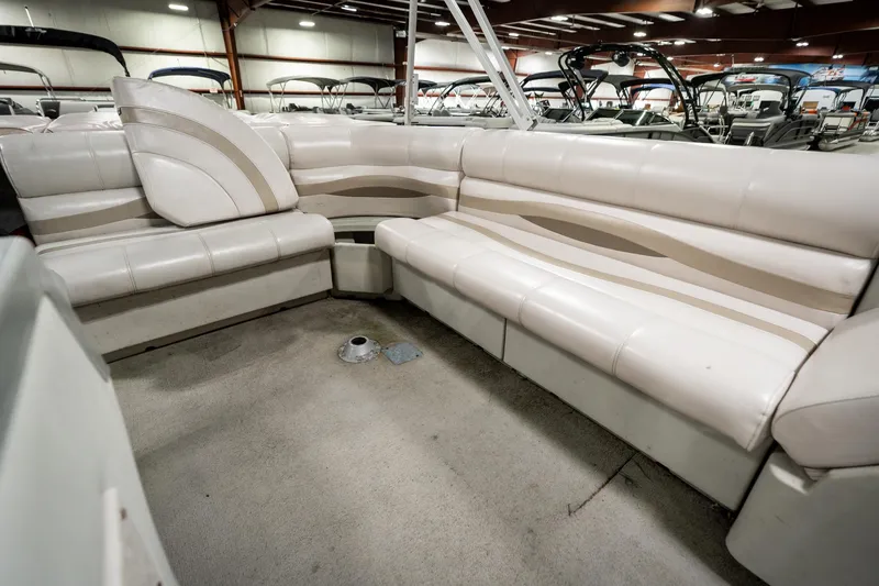 Slide: The Image of 1992 Harris FloteBote 240 Super Sunliner interior with beige seating in a showroom. - 28