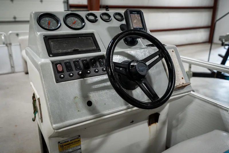 Slide: The Image of Steering console of a 1992 Harris FloteBote 240 Super Sunliner pontoon boat. - 31