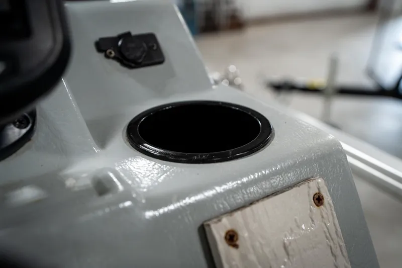 Slide: The Image of Close-up of a 1992 Harris FloteBote 240 Super Sunliner cup holder on a boat console. - 37