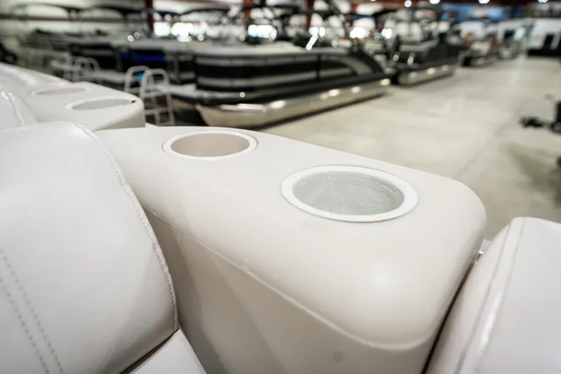 Slide: The Image of 1992 Harris FloteBote 240 Super Sunliner interior with cup holders in a showroom. - 39