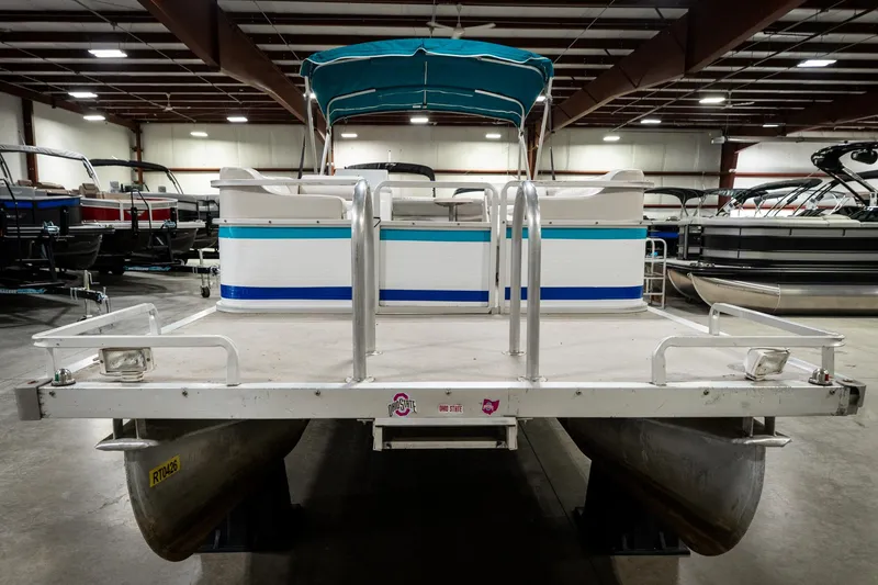 Slide: The Image of 1992 Harris FloteBote 240 Super Sunliner pontoon boat in indoor showroom. - 4