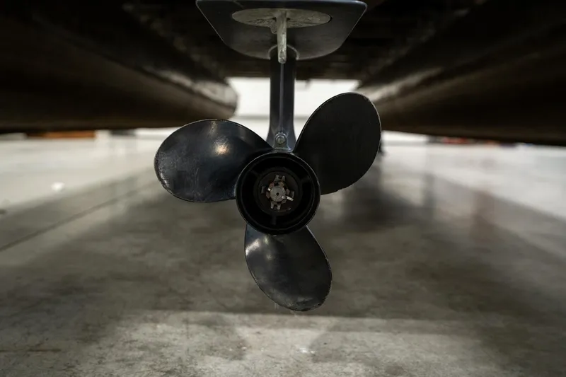 Slide: The Image of Close-up of a 1992 Harris FloteBote 240 Super Sunliner propeller in a garage. - 42