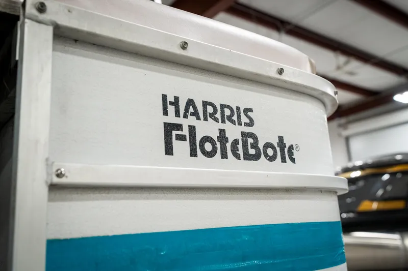 Slide: The Image of Close-up of 1992 Harris FloteBote 240 Super Sunliner logo on boat exterior. - 44