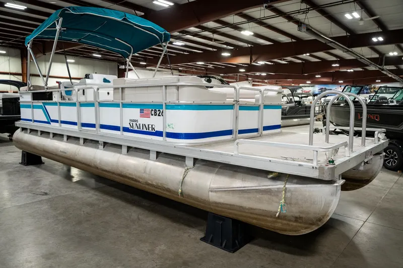 Slide: The Image of 1992 Harris FloteBote 240 Super Sunliner pontoon boat in indoor showroom. - 5